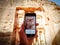 People taking photos of the Treasury in Petra, Jordan.