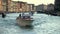 People taking Selfies aboard a motorboat on The Grand Canal, Venice, Italy