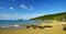 People taking sun bath in the sunset on the beautiful Plage De La Perle on Basse-Terre on Guadeloupe island