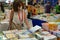 People and teenagers seeking for a book at international book fair Turin Italy