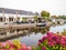 People on terrace of cafe restaurant by canal in village of Warten, Leeuwarden, Netherlands