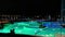 People in thermal pool outdoor in the night at Therme Bucharest, Romania