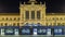 People on the Tomislav Square in front of Main Railway Station night timelapse, main hub of Croatian Railways network