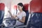 People is touching virtual screen in airplane , modern technology and transportation concept