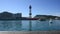 People on the tourist boat in the port of Barcelona, behind you can see the tower of the cableway of the port