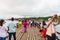 People and tourists sightseeing at Uttama Nusorn Wooden Bridge, Mon bridge