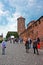 People at Tower and entrance gate at Wawel Castle in Krakow