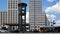 People And Traffic At The Clock At Famous Potsdamer Platz In Berlin In Summer