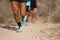 People trail running on a mountain path