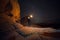 People Travel to scenic destination concept. Tourist man walking holding the light traveling in mountains and enjoy the night sky