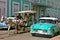 People traveling in a horse carriage in Cuba