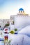People Travelling. European Destinations. Ancient Famous Blue Dome of Oia Village Church on Santorini Island in Greece