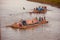 People travelling on a traditional boat in the river unique photo