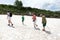 People trekking across glacier of Lago-Naki plateau