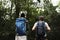 People trekking in a forest