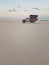 People in a truck at the dunes and sea - Santo Amaro, LenÃ§ois Maranhenses, MaranhÃ£o, Brazil.