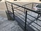 People used to hold this stainless steel handrail black painted for ramp access and possibility of Spreading corona virus disease