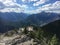 People at the viewpoint gazing at the beautiful landscape of big mountains and a river in Canada