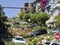 People visit the Lombard street in San Francisco. It is  known for the  section on Russian Hill between Hyde and Leavenworth, in