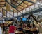 People visiting and eating in the famous central market of Florence called `Mercato centrale`