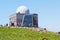 People visiting peak of Brocken Mountain in Harz mountain area. Touristic house and hotel on peak