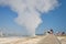 People visiting Yellowstone national park, path and steam from a hot spring