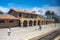 people wait for the pacific surfliner train at old mexican style Santa Barbara station