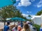 People waiting in line to get temperature checks before they can enter the Seaworld and Aquatica theme parks