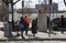 People waiting for number six bus at transit stop Bronx NY