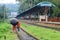 People are waiting in the rain for the train. It is a rainy railway station. University of Chittagong, Bangladesh railway station