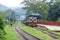 People are waiting in the rain for the train. It is a rainy railway station. University of Chittagong, Bangladesh railway station