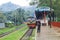 People are waiting in the rain for the train. It is a rainy railway station. University of Chittagong, Bangladesh railway station