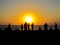 The people waiting the sunset in the beach