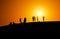 People are waiting for sunset at the edge of the sand dune Red sand dune with orange sky background in summer in Mui Ne, Vietnam