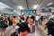 People waiting for train at the waiting hall near timetable monitors in railroad station