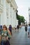People walk along Nevsky Prospect in St. Petersburg. Vertical photo