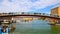 People walk along the pedestrian bridge across the Gran Canal in Venice Italy