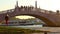 People walk along the pedestrian bridge across the Gran Canal in Venice Italy