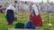 People walk around in historical costumes in the center of the event tournament. Festival of the middle ages