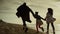 People walk beach happily. Family having fun on sea holiday together outdoors.