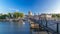 People walk on the Bridge of Arts over the River Seine to the Institute of France timelapse - Paris, France