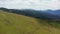 People walk on a chairlift in the open air and enjoy the picturesque views of mountains and forests. Theme of travel and tourism