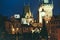 People walk on Charles Bridge, Prague at night