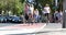 People walk cross the road, and cyclist ride bicycle on bicycle lane at pedestrian crossing.