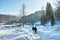 People walk in deep snow magic winter landscape