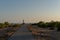 People walk down the street towards the Cap de Barbarie Lighthouse in Formentera in the summer of 2021