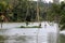 People walk through the flooded farms