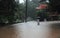 People walk through the flooded roads