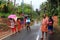 People walk through the flooded roads