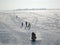 People walk on the frozen river, sledding, skiing and Snowmobiling. Russia, Saratov - january, 2016